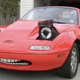 Illustration for article titled We Truly Cannot Decide Which Of These Miatas Is More Ridiculous